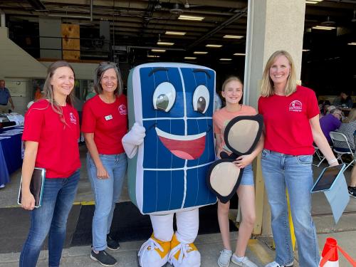 Co-op employees with Solar Sam